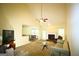Inviting living room with a fireplace, comfortable seating, and access to the dining area at 25 Pacific Ave, Sharpsburg, GA 30277