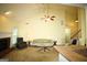 Bright living space with high ceilings, fireplace, and a view into the adjacent kitchen area at 25 Pacific Ave, Sharpsburg, GA 30277