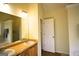 Main bathroom featuring double vanity sinks, a large mirror, and natural light from an exterior window at 25 Pacific Ave, Sharpsburg, GA 30277