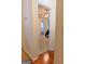 The entry to this carpeted main bedroom shows a ceiling fan and ensuite bathroom at 25 Pacific Ave, Sharpsburg, GA 30277