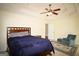 Spacious main bedroom with tray ceiling, ceiling fan, ensuite bathroom access, and a cozy sitting area at 25 Pacific Ave, Sharpsburg, GA 30277