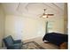 Spacious main bedroom features tray ceiling, ceiling fan, carpeted floors, and ensuite bathroom access at 25 Pacific Ave, Sharpsburg, GA 30277