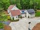 Aerial view of the home and property featuring a garage with a basketball hoop at 400 Peachtree Pkwy, Peachtree City, GA 30269
