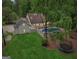 Aerial view of the property highlighting the pool, spacious yard, and surrounding greenery at 400 Peachtree Pkwy, Peachtree City, GA 30269