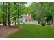 Spacious backyard featuring lush greenery and a white picket fence at 400 Peachtree Pkwy, Peachtree City, GA 30269