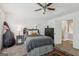 Cozy bedroom with ceiling fan, closet, neutral tones, and double bass at 400 Peachtree Pkwy, Peachtree City, GA 30269