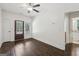 Inviting bedroom with hardwood floors and white walls features a door leading to the backyard at 400 Peachtree Pkwy, Peachtree City, GA 30269