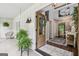 Inviting foyer with tile flooring, modern decor, and an open view to the living room beyond at 400 Peachtree Pkwy, Peachtree City, GA 30269
