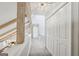 Upstairs hallway features exposed beams, carpet, and closet space at 400 Peachtree Pkwy, Peachtree City, GA 30269