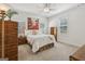Cozy main bedroom with carpet, neutral paint, and plenty of natural light from the bright windows at 400 Peachtree Pkwy, Peachtree City, GA 30269