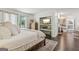 Bright bedroom featuring stylish decor, fireplace and balcony access with beautiful natural light at 400 Peachtree Pkwy, Peachtree City, GA 30269