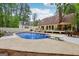 Beautiful pool with a diving board, pool house, and deck, perfect for summer fun at 400 Peachtree Pkwy, Peachtree City, GA 30269