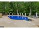Lovely pool with a hot tub and lounge chairs surrounded by lush greenery at 400 Peachtree Pkwy, Peachtree City, GA 30269