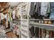 Spacious walk-in closet with custom shelving and storage solutions for clothing, shoes, and accessories at 400 Peachtree Pkwy, Peachtree City, GA 30269