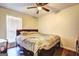 This bedroom features hardwood floors and natural lighting at 70 Grove Creek Dr, Locust Grove, GA 30248