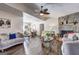 Spacious living room featuring wood floors, stone fireplace and comfortable seating at 70 Grove Creek Dr, Locust Grove, GA 30248
