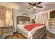 Comfortable main bedroom featuring hardwood floors, ceiling fan and decor at 70 Grove Creek Dr, Locust Grove, GA 30248