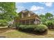 Large backyard with mature trees, beautiful greenery and patio at 891 Berryman Pl, Lawrenceville, GA 30045