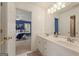 Bathroom featuring double sinks in a white vanity with modern fixtures at 891 Berryman Pl, Lawrenceville, GA 30045
