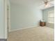 Bedroom with neutral walls, carpet flooring, and a closet at 891 Berryman Pl, Lawrenceville, GA 30045