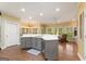 Spacious kitchen with custom island, abundant lighting, and hardwood floors at 891 Berryman Pl, Lawrenceville, GA 30045