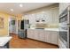 Updated kitchen with stainless steel appliances, and spacious layout at 891 Berryman Pl, Lawrenceville, GA 30045