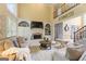 Spacious living room with fireplace, built-in shelving, and staircase at 891 Berryman Pl, Lawrenceville, GA 30045