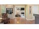 Comfortable open-concept living room featuring hardwood floors and a coffee bar at 891 Berryman Pl, Lawrenceville, GA 30045