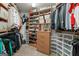 Organized walk-in closet with shelves, rods, and storage drawers for maximum storage and convenience at 891 Berryman Pl, Lawrenceville, GA 30045