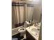 Bathroom with shower and tub, floral shower curtain, and a dark rug at 1975 Longwood Ct, Lithonia, GA 30058