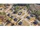 This aerial view highlights the layout of a residential community with numerous homes, winding roads, and green spaces at 240 Sturry Dr # 71, Mcdonough, GA 30252