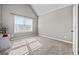 Bright bedroom with neutral walls, plush carpet, and a window offering natural light, creating a serene and inviting space at 240 Sturry Dr # 71, Mcdonough, GA 30252