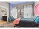 Cozy bedroom with unique decor, a bright blue LED strip and a door to the bathroom, creating a fun and inviting space at 240 Sturry Dr # 71, Mcdonough, GA 30252