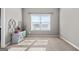 Sunlit bedroom featuring neutral walls, carpet, and a window providing ample natural light, creating a comfortable and inviting space at 240 Sturry Dr # 71, Mcdonough, GA 30252