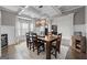 Elegant dining room with coffered ceilings, modern lighting, and beautiful hardwood floors at 240 Sturry Dr # 71, Mcdonough, GA 30252