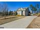Charming home with a well-maintained lawn, driveway, and mature trees, showcasing curb appeal and inviting exterior features at 240 Sturry Dr # 71, Mcdonough, GA 30252