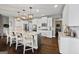 Modern kitchen with white cabinetry, granite countertops, stainless steel appliances, and a spacious island at 240 Sturry Dr # 71, Mcdonough, GA 30252