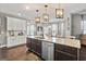 Open concept kitchen features a center island, stainless steel appliances, and lots of cabinet space at 240 Sturry Dr # 71, Mcdonough, GA 30252