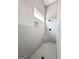 This is a tiled shower with a built-in seat and a window to let natural light shine through at 240 Sturry Dr # 71, Mcdonough, GA 30252