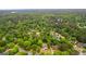 An aerial view shows the home nestled in a tree-filled neighborhood at 608 Bellenden Dr, Peachtree City, GA 30269