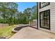 Beautiful backyard featuring a stone fire pit and a manicured lawn, perfect for outdoor entertaining at 608 Bellenden Dr, Peachtree City, GA 30269