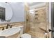 Beautiful bathroom with elegant fixtures, tiled shower with glass door and built-in shelves at 608 Bellenden Dr, Peachtree City, GA 30269