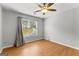 Bedroom featuring wood laminate flooring, a window with curtains and neutral walls at 608 Bellenden Dr, Peachtree City, GA 30269