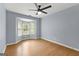 Empty bedroom features wood laminate flooring, light blue walls and a bay window at 608 Bellenden Dr, Peachtree City, GA 30269
