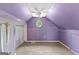 Attic bedroom space with plush carpeting, neutral paint, and fan at 608 Bellenden Dr, Peachtree City, GA 30269
