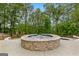 Relaxing backyard featuring a stone hot tub, perfect for entertaining at 608 Bellenden Dr, Peachtree City, GA 30269