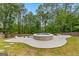 Inviting backyard with a built-in hot tub and mature trees at 608 Bellenden Dr, Peachtree City, GA 30269