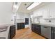 Updated kitchen featuring white cabinets, subway tile backsplash, and stainless steel appliances at 608 Bellenden Dr, Peachtree City, GA 30269