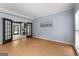 Inviting living room with hardwood floors, light blue walls and beautiful french doors at 608 Bellenden Dr, Peachtree City, GA 30269