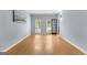 Bright living room with hardwood floors, natural light from windows and blue accent wall at 608 Bellenden Dr, Peachtree City, GA 30269